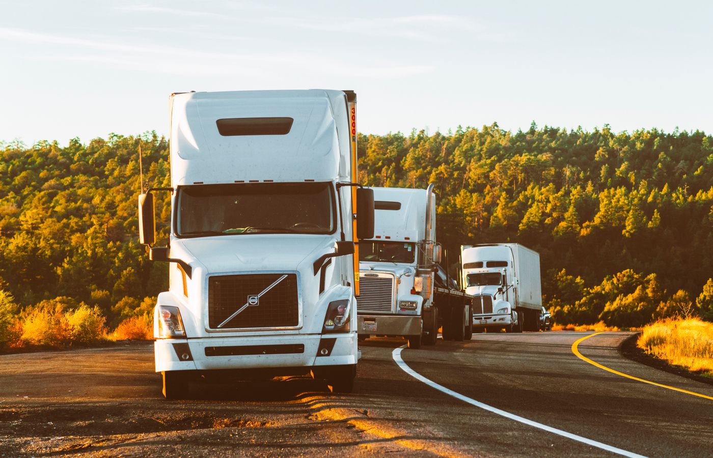 Fuel tanker trucks on the highway for bulk fuel delivery